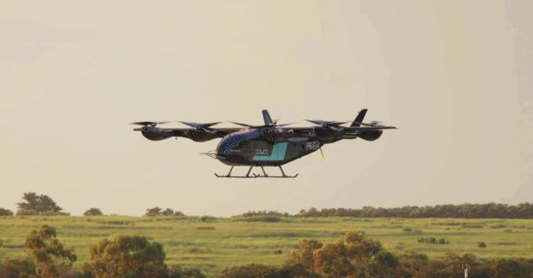 Flying drone over green landscape